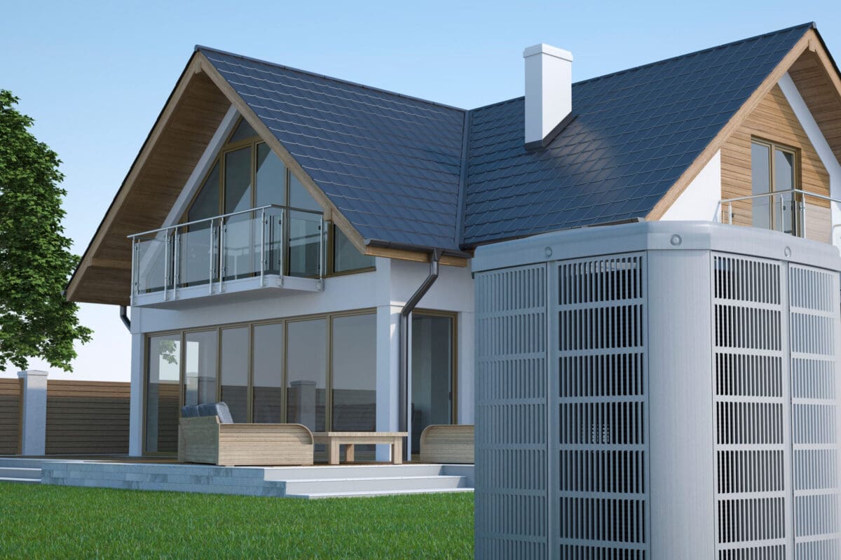 A heat pump with a home in the background