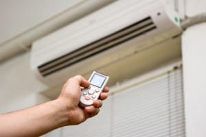 Turning on a ductless mini-split AC system in a Houston home